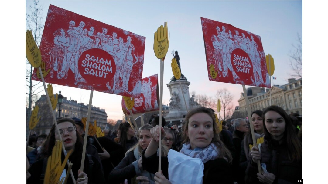 FILE - People take to the streets near Republique square to protest anti-Semitism, in Paris, France, Feb. 19, 2019.