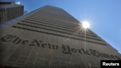 FILE - The sun peeks over The New York Times Building in New York, Aug. 14, 2013. 