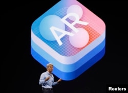 Craig Federighi, Senior Vice President Software Engineering speaks about "Augmented Reality" during Apple's annual world wide developer conference (WWDC) in San Jose, California, June 5, 2017.