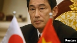 Japan's Foreign Minister Fumio Kishida attends a media briefing with his Vietnamese counterpart Pham Binh Minh after their meeting at the Government Guesthouse in Hanoi, August 1, 2014. 
