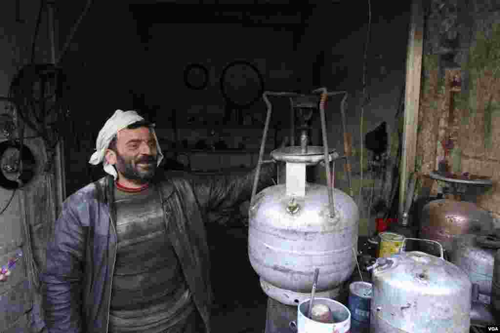 A man sells gas stoves in Aleppo, Syria, Feb. 28, 2013.&nbsp;