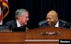 House Oversight and Reform Committee chairman Elijah Cummings (D-MD) confers with Ranking Member Rep Mark Meadows (R-NC) during a debate on the possibility of issuing a subpoena to a former White House security clearance chief.