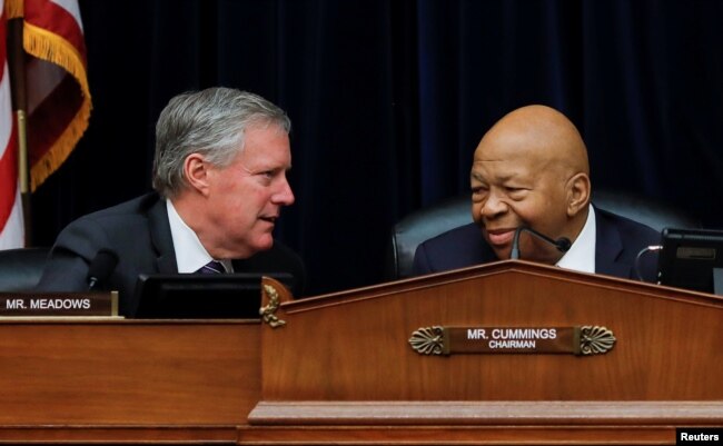 House Oversight and Reform Committee chairman Elijah Cummings (D-MD) confers with Ranking Member Rep Mark Meadows (R-NC) during a debate on the possibility of issuing a subpoena to a former White House security clearance chief.