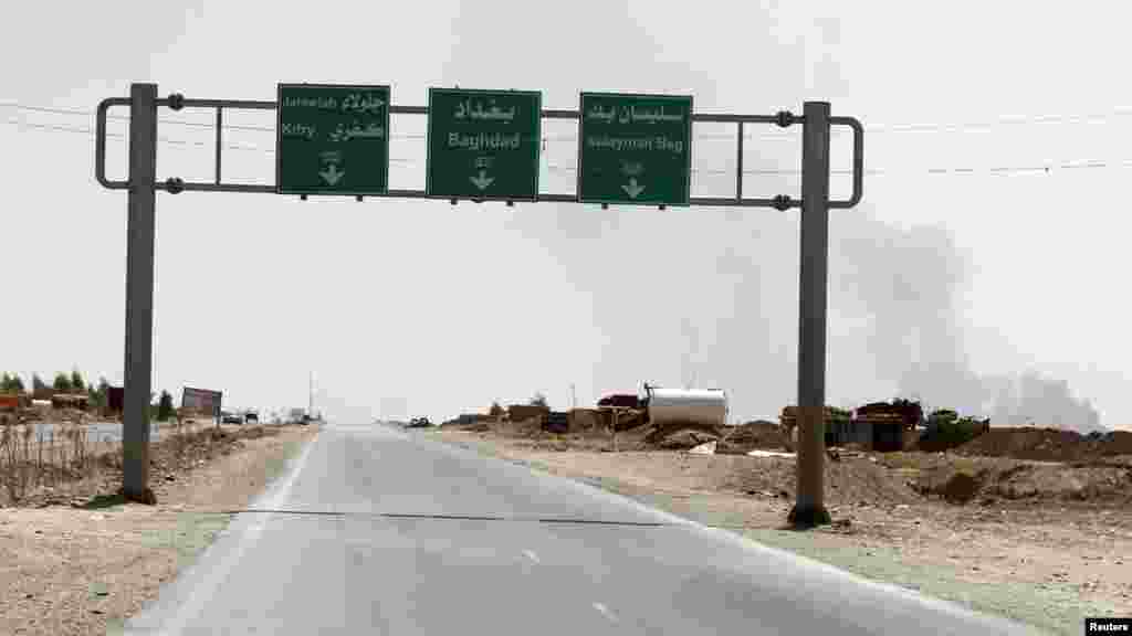 A general view of road sign and a road in Sulaiman Pek in Salahuddin province, Iraq, Aug. 31, 2014. 