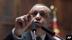 Turkey's President Recep Tayyip Erdogan addresses lawmakers at the parliament in Ankara, Turkey, Jan. 16, 2018.