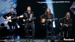 FILE - Imagine Dragons performs during the taping of "The Night That Changed America: A Grammy Salute To The Beatles," which commemorates the 50th anniversary of The Beatles appearance on the Ed Sullivan Show, in Los Angeles, Jan. 27, 2014. 