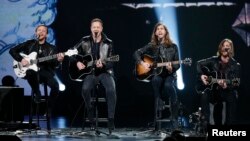 FILE - Imagine Dragons performs during the taping of "The Night That Changed America: A Grammy Salute To The Beatles", which commemorates the 50th anniversary of The Beatles appearance on the Ed Sullivan Show, in Los Angeles January 27, 2014. 