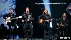 FILE - Imagine Dragons performs during the taping of "The Night That Changed America: A Grammy Salute To The Beatles", which commemorates the 50th anniversary of The Beatles appearance on the Ed Sullivan Show, in Los Angeles January 27, 2014.