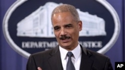 Attorney General Eric Holder takes part in a news conference at the Justice Department in Washington, 06 Dec 2010