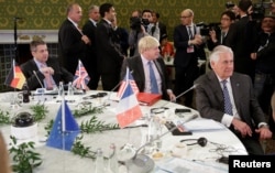 German Foreign Minister Sigmar Gabriel (L), Britain's Foreign Secretary Boris Johnson (C), and U.S. Secretary of State Rex Tillerson attend roundtable talks during a G-7 for foreign ministers in Lucca, Italy, April 11, 2017.