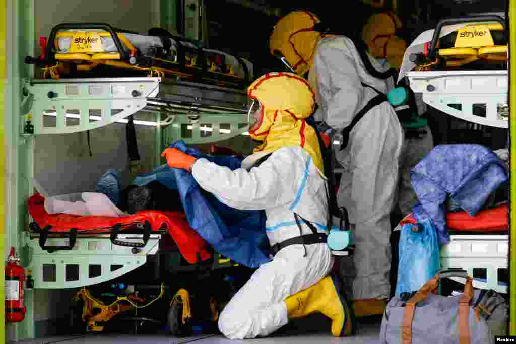 Prague Emergency Medical Services transport patients in a special ambulance truck from an overflowing hospital during the coronavirus outbreak in Ceska Lipa, Czech Republic.