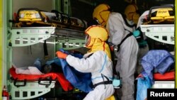 Prague Emergency Medical Services transport patients in a special ambulance truck from an overflowing hospital during the coronavirus outbreak in Ceska Lipa, Czech Republic.