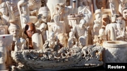 Dozens of confiscated carved ivory sculptures are displayed before 6 tons of ivory was crushed in Denver, Colorado November 14, 2013. The U.S. Fish and Wildlife Service organized the crushing. REUTERS/Rick Wilking (UNITED STATES - Tags: CRIME LAW ANIMALS