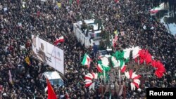 People attend a funeral procession for Iranian Major-General Qassem Soleimani, head of the elite Quds Force, and Iraqi militia commander Abu Mahdi al-Muhandis, who were killed in an air strike at Baghdad airport, in Tehran, Iran, January 6, 2020. (Nazanin Tabatabaee/WANA)