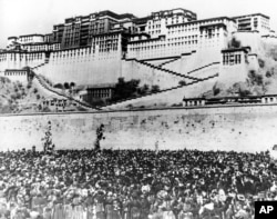 In this March 17, 1959 file photo thousands of Tibetan women silently surround the Potala Palace, the main residence of the Dalai Lama, the Tibetan leader, to protest against Chinese rule.