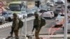 Israeli Troops Arrest dozens in West Bank