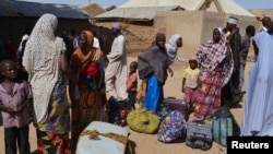 FILE - Families from Gwoza, Borno State, displaced by the violence and unrest caused by the insurgency, are seen at a refugee camp in Mararaba Madagali, Adamawa State, Feb. 18, 2014.