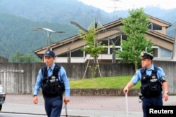 Police officers are seen in front of a facility for the disabled, where at least 19 people were killed by a knife-wielding man in Sagamihara, Kanagawa prefecture, Japan, July 26, 2016.