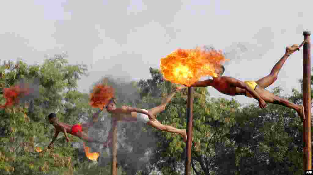 Indian soldiers take part in a demonstration of 'fire breathing' at the start of Operation Hand in Hand - a joint training exercise between Indian and Chinese troops - at Aundh Military Camp in Pune, Nov. 18, 2014.