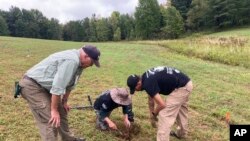 Veterans work at an archaeological dig at the site of the Second Battle of Saratoga, Sept. 9, 2021, in Stillwater, NY.