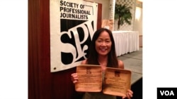 VOA stringer Heidi Chang accepts the SPJ awards 