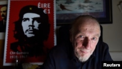 Artist Jim Fitzpatrick who has created an Irish postage stamp using the poster of Che Guevara he created in 1968 entitled 'Viva Che!' based on a photograph by Alberto Korda poses for a picture at his studio in Dublin, Ireland, Oct. 11, 2017. 