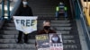 Pro-democracy supporters protest outside China's Liaison Office, in Hong Kong, China on Dec. 28, 2020, to urge for the release of citizen journalist Zhang Zhan and other Hong Kong activists.