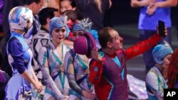 A clown holds up his cell phone to record the end of the final show of the Ringling Bros. and Barnum & Bailey Circus, May 21, 2017.