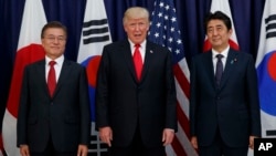 President Donald Trump meets with Japanese Prime Minister Shinzo Abe, right, and South Korean President Moon Jae-in before the Northeast Asia Security dinner at the US Consulate General in Hamburg, Germany, July 6, 2017.