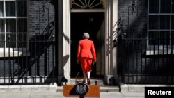 British Prime Minister Theresa May leaves after delivering a statement in London, Britain, May 24, 2019.