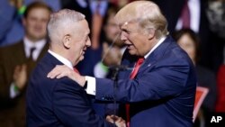 FILE - President-elect Donald Trump introduces retired Marine Corps Gen. James Mattis as his nominee for Secretary of Defense in Fayetteville, N.C., Dec. 6, 2016. Secretary of Defense James Mattis is leading a review of the US nuclear weapons.