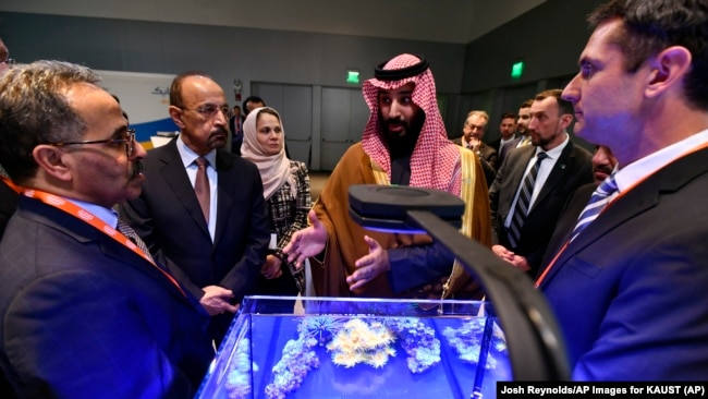 Saudi Crown Prince Mohammed bin Salman view a showing of Saudi Arabian technology, including an exhibit by King Abdullah University of Science and Technology, during a visit to Massachusetts Institute of Technology on Saturday, March 24, 2018.