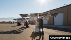 This photo shows Loon team members working on the solar-powered equipment that sends the high-speed internet signal to the ground in areas with no connectivity. (Source: Loon)