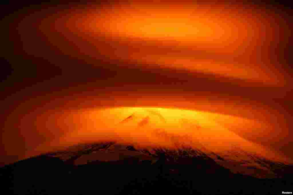 The Villarrica Volcano is seen partially covered by clouds at Pucon, Chile, May 18, 2015.