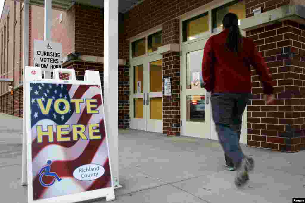 A voter arrives to cast his ballot in the U.S. Republican presidential primary at a polling place at Dreher High School in Columbia, S.C., Feb. 20, 2016. 