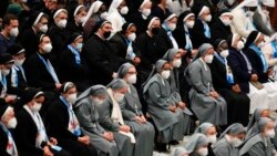 Nuns wearing FFP2 masks listen to Pope Francis during his weekly general audience in the Paul VI Hall, at the Vatican, Jan. 5, 2022.