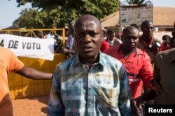 Presidential candidate Jose Mario Vaz leaves a polling station after voting in Bissau, April 13, 2014.