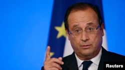 France's President Francois Hollande delivers a speech during the annual Conference of Ambassadors in Paris, Aug. 27, 2013. 