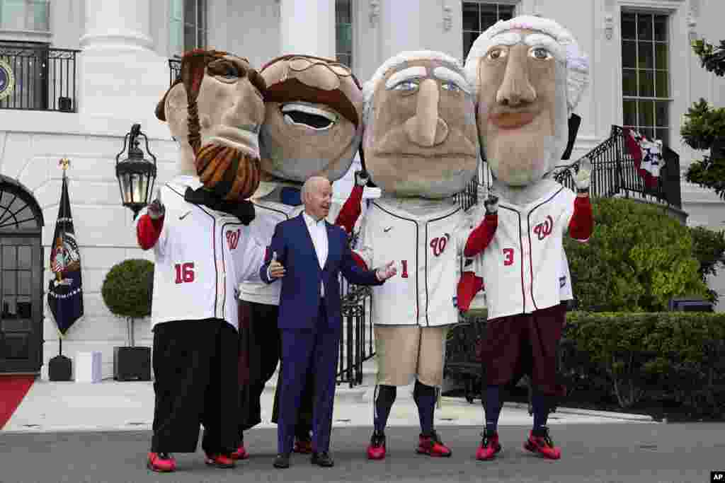 President Joe Biden is seen with members of the Washington Nationals baseball team called &quot;The Racing Presidents&quot; after speaking at an Independence Day celebration on the South Lawn of the White House, July 4, 2021, in Washington.