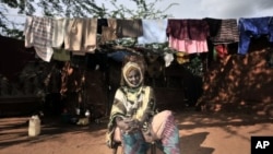 Suban Abdi, who claims one of her sons was recruited into mercenary forces trained by the Kenyan army, sits in a refugee camp, in Dadaab, eastern Kenya. (file photo)