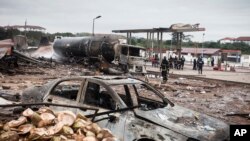 Firemen at the site of Saturday's gas tanker explosion in Accra, Ghana, Oct. 8, 2017. 