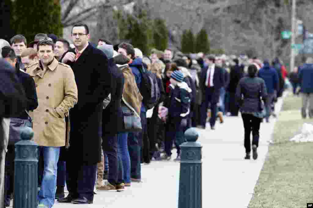 People stand in line to view the casket of Justice Antonin Scalia at the U.S. Supreme Court in Washington, Feb. 19, 2016.
