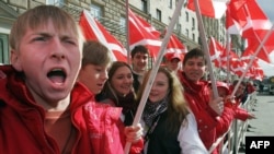 FILE - A member of pro-Kremlin "Nashi" (our people) movement shouts anti-American slogans in front of the US embassy in Moscow.