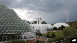 In this July 31, 2015 photo, several of the main buildings of the Biosphere 2 complex, including the tropical rainforest, the technosphere, and the south lung, in Oracle, Ariz. (AP Photo/Ross D. Franklin)