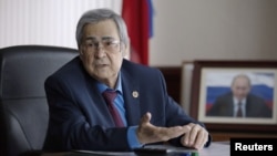 FILE - Governor of the Kemerovo region, Aman Tuleyev, speaks during a meeting in Kemerovo, Russia, March 7, 2018 Tuleyev announced his resignation Sunday.