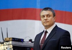 FILE - Acting head of the self-proclaimed separatist Luhansk People's Republic (LNR) Leonid Pasechnik stands on the stage during his pre-election address ahead of the upcoming vote for a new leader in Luhansk, Ukraine, Nov. 8, 2018.