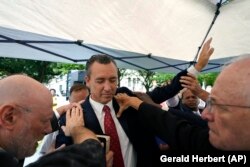 FILE - In this June 7, 2021 file photo, Tony Spell, pastor of the Life Tabernacle Church of Central City, La., prays with supporters outside the Fifth Circuit Court of Appeals in New Orleans.