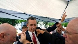FILE - In this June 7, 2021 file photo, Tony Spell, pastor of the Life Tabernacle Church of Central City, La., prays with supporters outside the Fifth Circuit Court of Appeals in New Orleans.