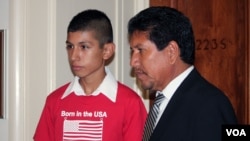 Saul Arellano, left, the son of a Mexican woman deported from the U.S., stands with an immigration activist at a meeting of the Congressional Hispanic Congress in Washington, DC on June 5, 2013. (Photo by Mitzi Macias) 