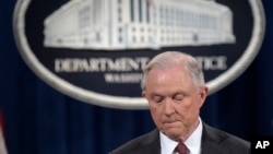 FILE - Attorney General Jeff Sessions pauses during a news conference at the Justice Department in Washington, March 2, 2017.